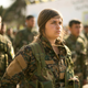U.S.-backed Syrian Democratic Forces (SDF) stand in formation at a ceremony to mark their defeat of Islamic State militants in Baghouz, at al-Omar Oil Field base, Syria, Saturday, March 23, 2019.